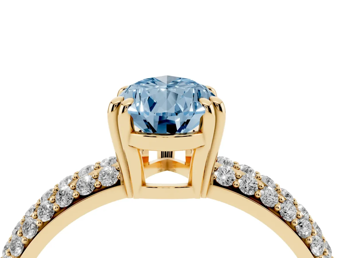 Fancy Blue Pear Cut Diamond Solitaire Ring with Multi-Row Round Pavé Band and Prong Setting Yellow gold