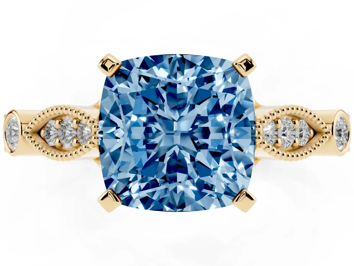 Fancy Blue Cushion Cut Cut Diamond with Milgrain Marquise and Bezel Accents on a Solitaire Band with Prong Setting Yellow gold