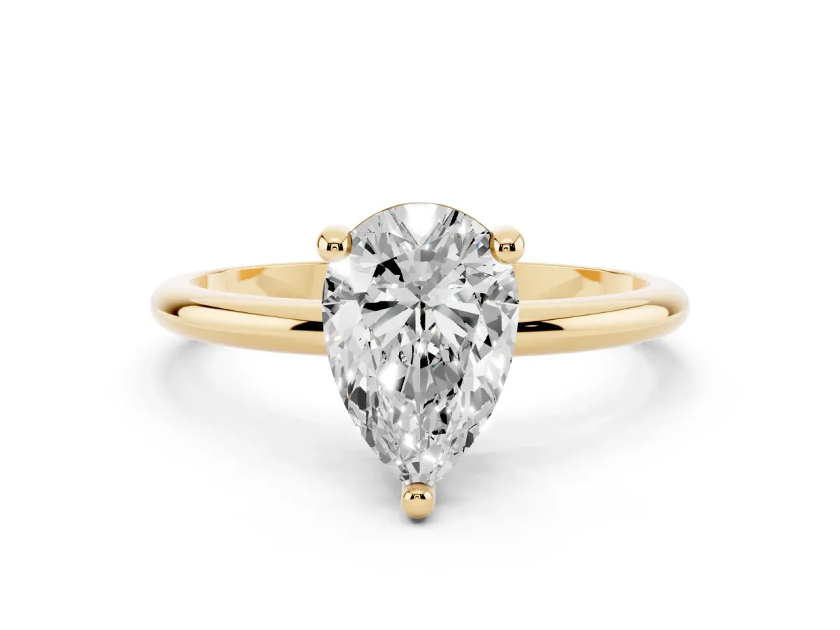Pear Cut Solitaire Diamond Ring with 4-Prong Setting on a Classic Band Yellow gold