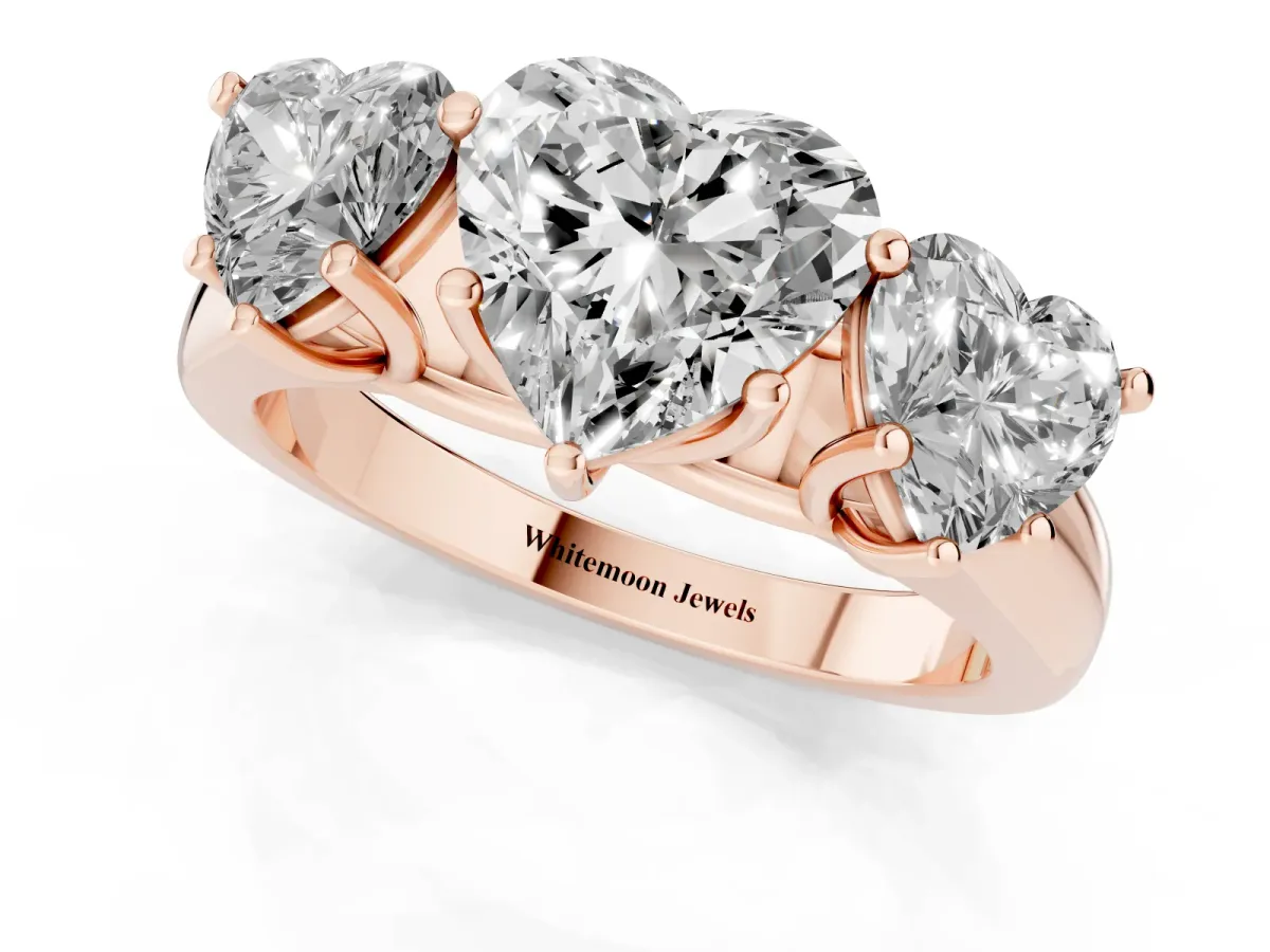 Heart Cut Three-Stone Diamond Ring with Prong Setting on a Classic Band Rose gold
