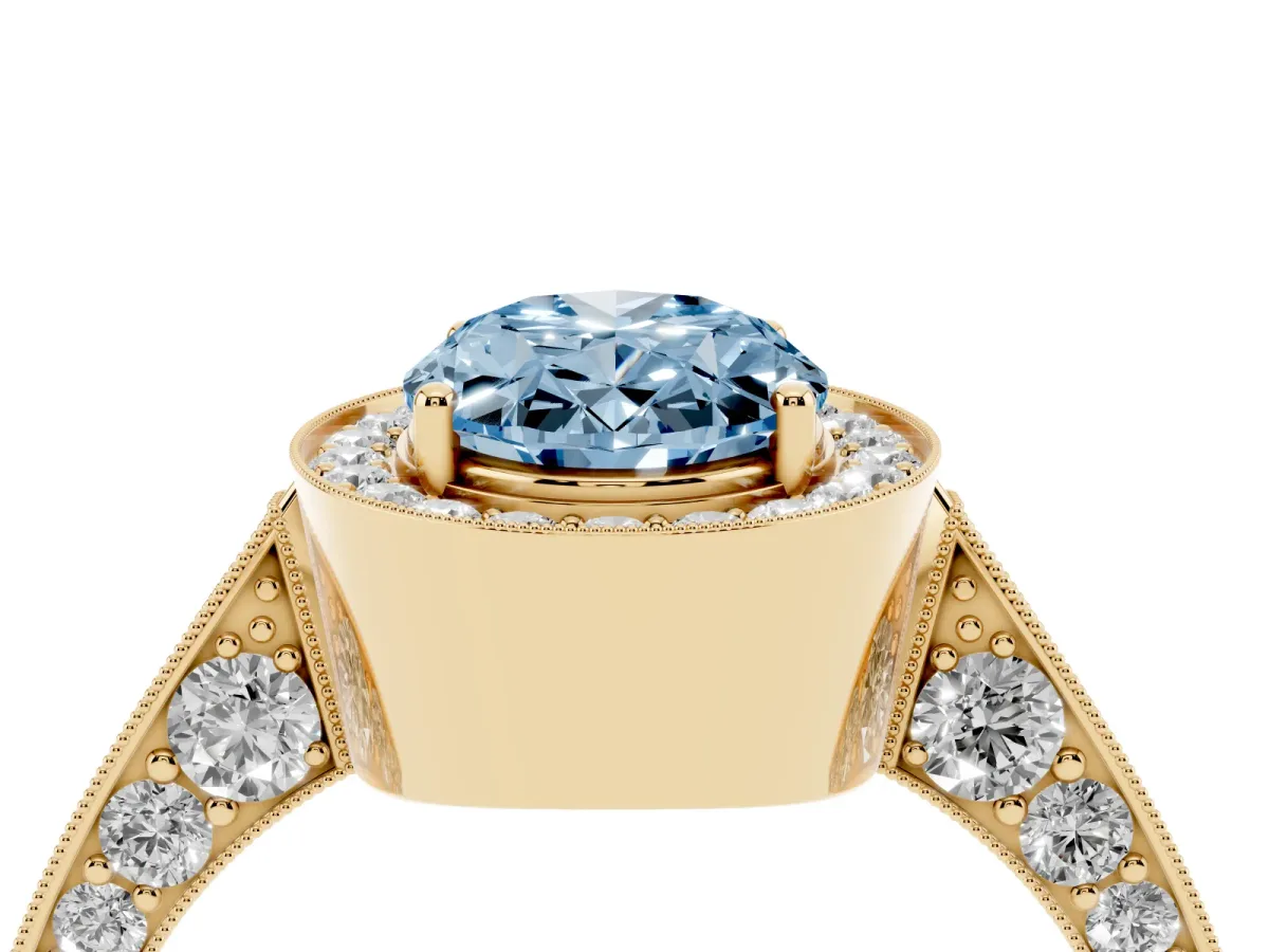 Fancy Blue Oval Cut Halo Diamond Engagement Ring with Split Shank Band and Four-Prong Setting Yellow gold