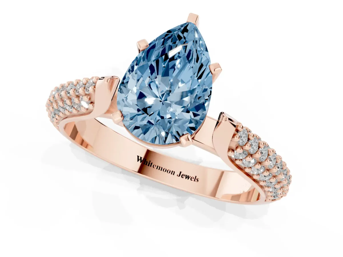 Fancy Blue Pear Cut Diamond Solitaire Engagement Ring with Multi-Row Round Pavé Band and Prong Setting Rose gold