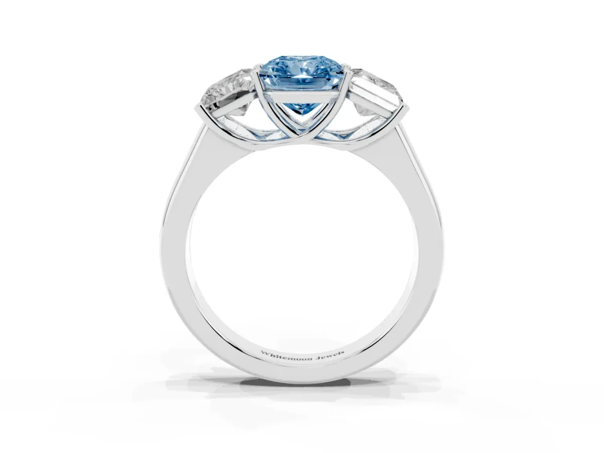 Fancy Blue Radiant Cut Three-Stone Diamond Ring with Prong Setting on a Classic Band Platinum