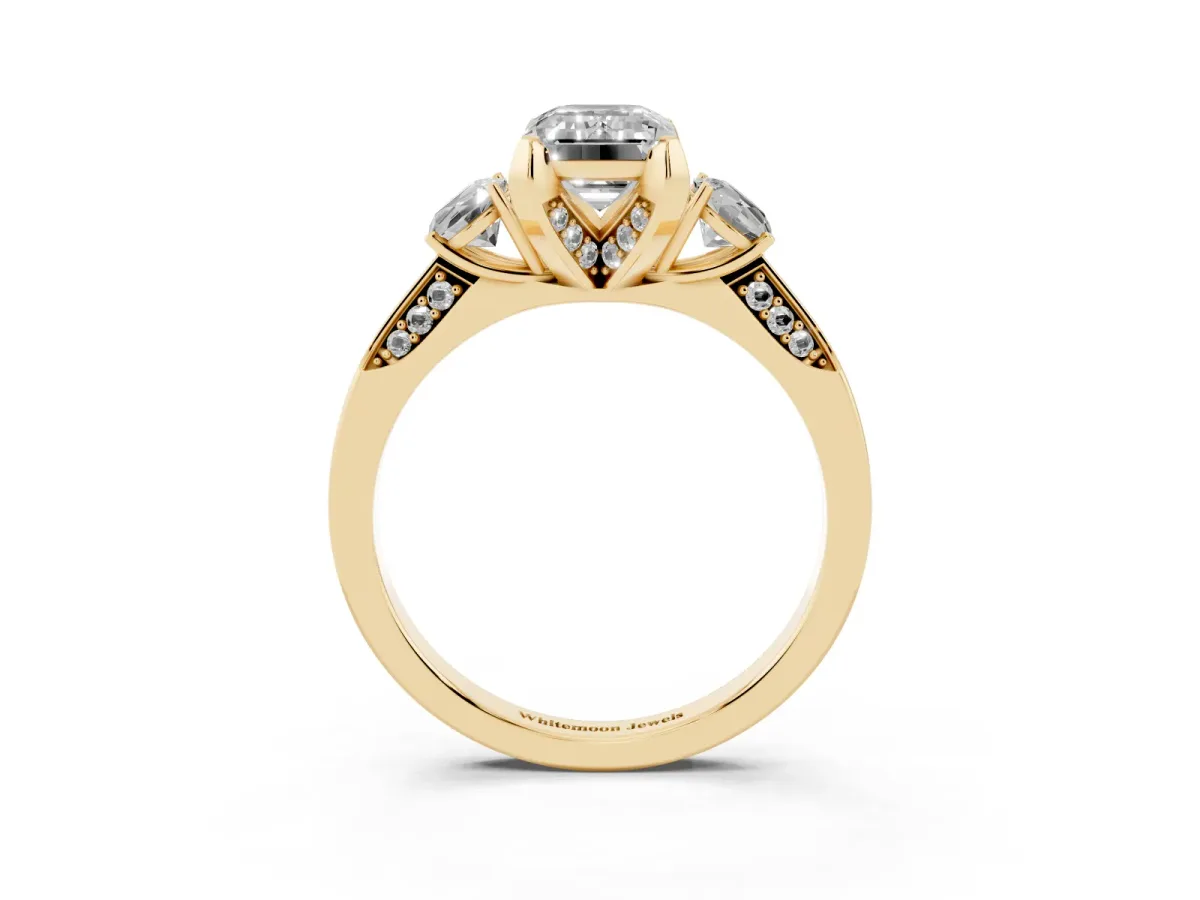 Fancy Pink Emerald Cut Brilliant Three-Stone Diamond Ring with Pavé Band and Four-Prong Setting Yellow gold