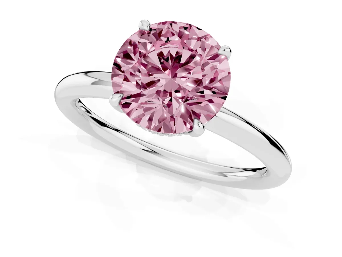 Fancy Pink Round Cut Diamond Solitaire Ring with Thin Band and Four-Prong Setting Silver