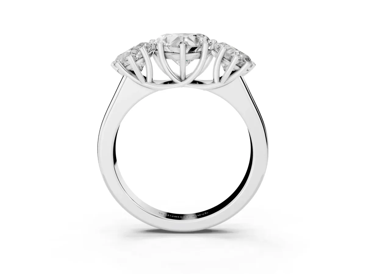 Heart Cut Three-Stone Diamond Ring with Prong Setting on a Classic Band White gold