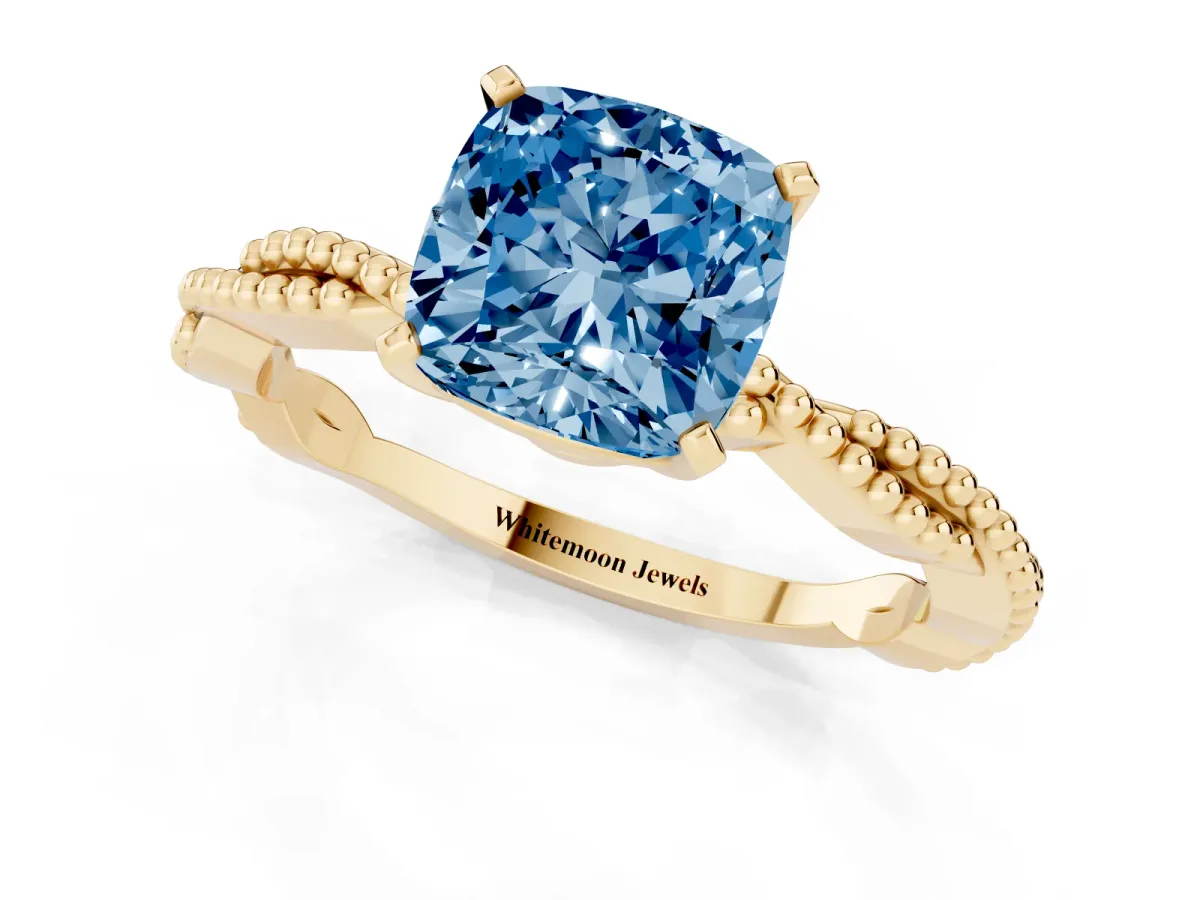 Fancy Blue Cushion Cut Solitaire Twisted Band with Bead Prong Setting Yellow gold