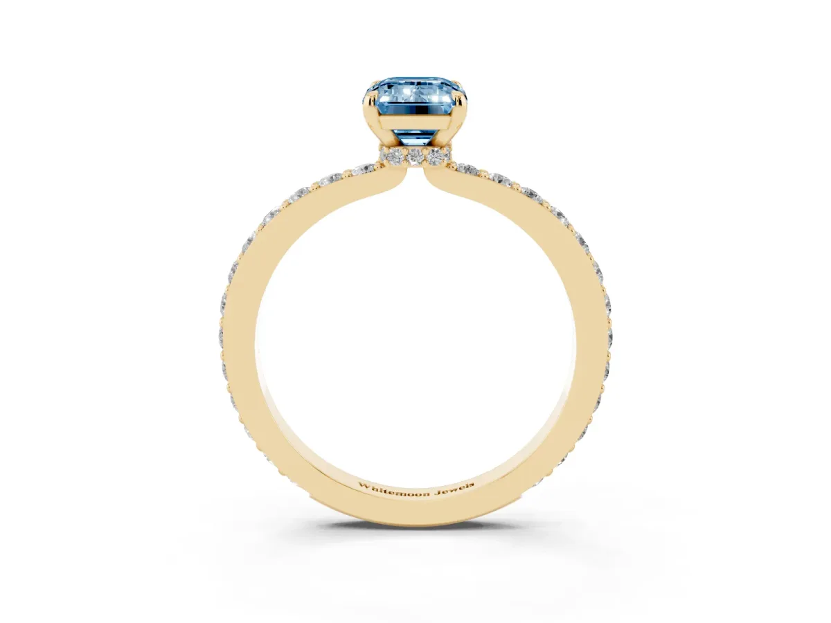 Fancy Blue Emerald Cut Diamond Pavé Engagement Ring with Round Accents and Prong Setting Yellow gold
