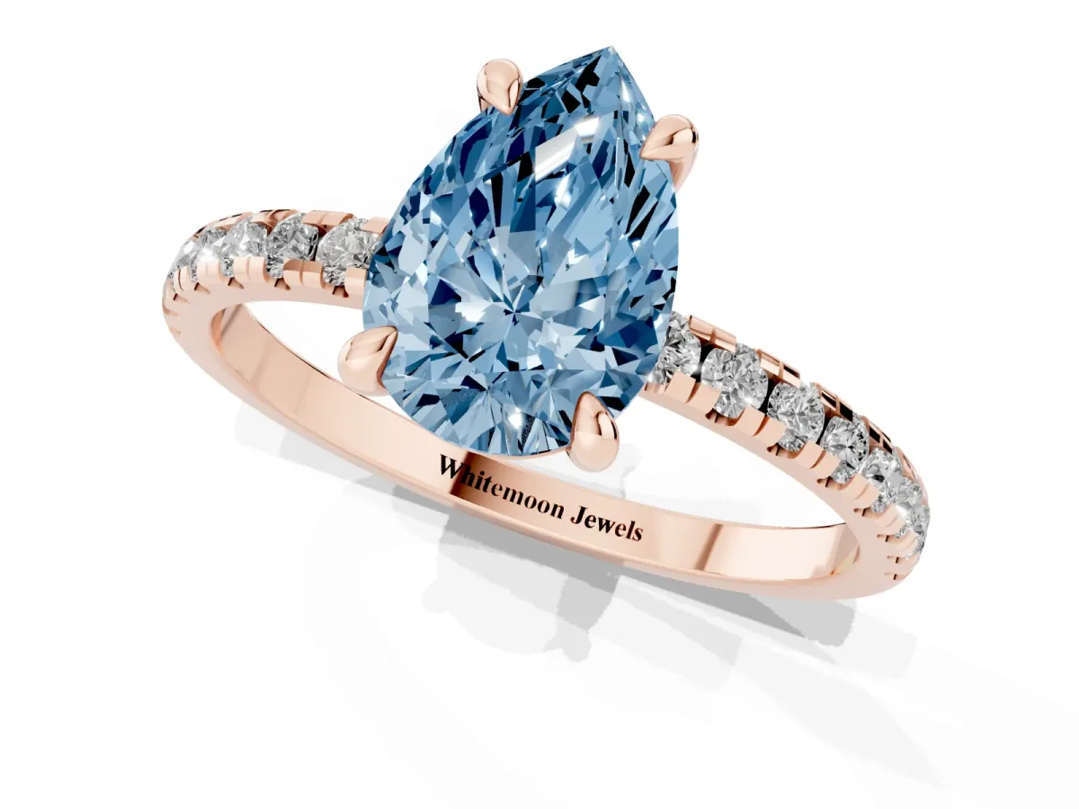 Fancy Blue Pear Cut Diamond Brilliant Solitaire Ring with Pavé Band and Four-Prong Setting Rose gold