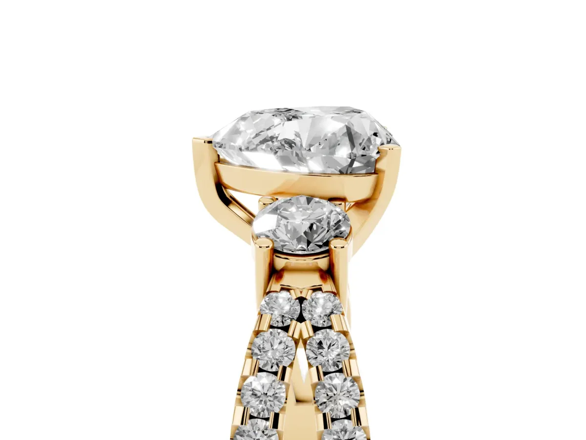 Heart Cut Diamond Three-Stone Ring with Pavé Split Shank and Four-Prong Setting Yellow gold