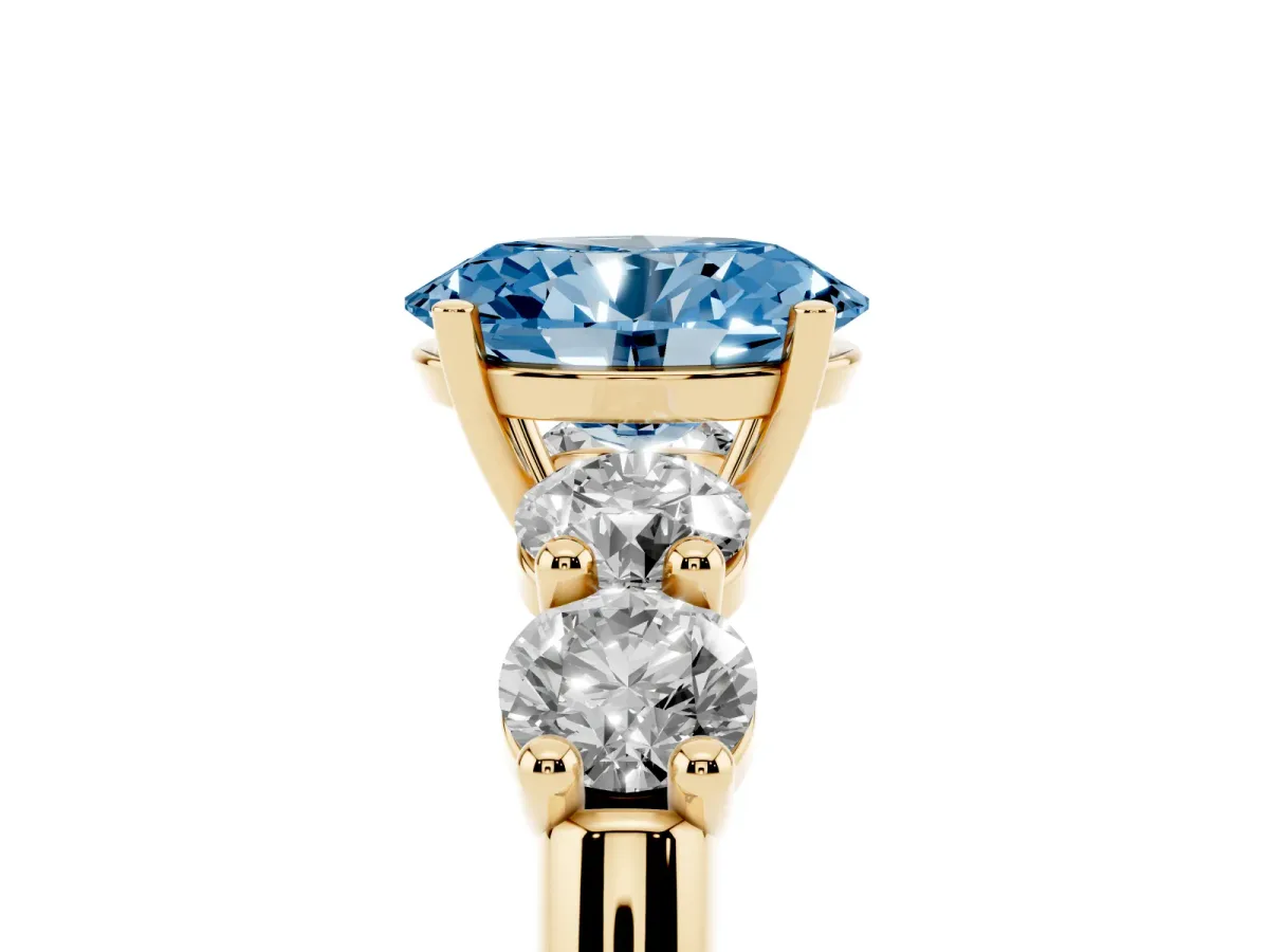 Fancy Blue Oval Cut Cut Five-Stone Prong Set Diamond Ring with Classic Band Yellow gold
