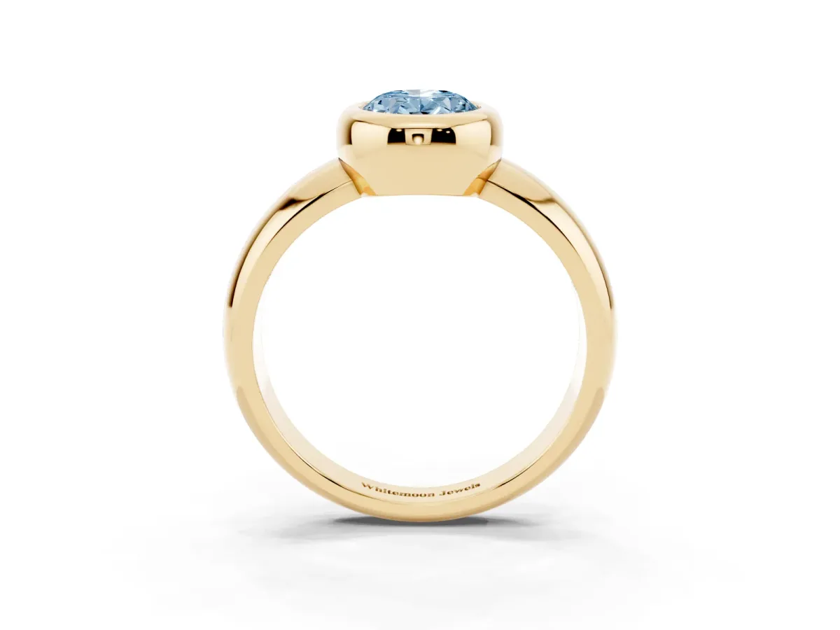 Fancy Blue Bezel Set Oval Cut Solitaire Ring with Wide Band Yellow gold