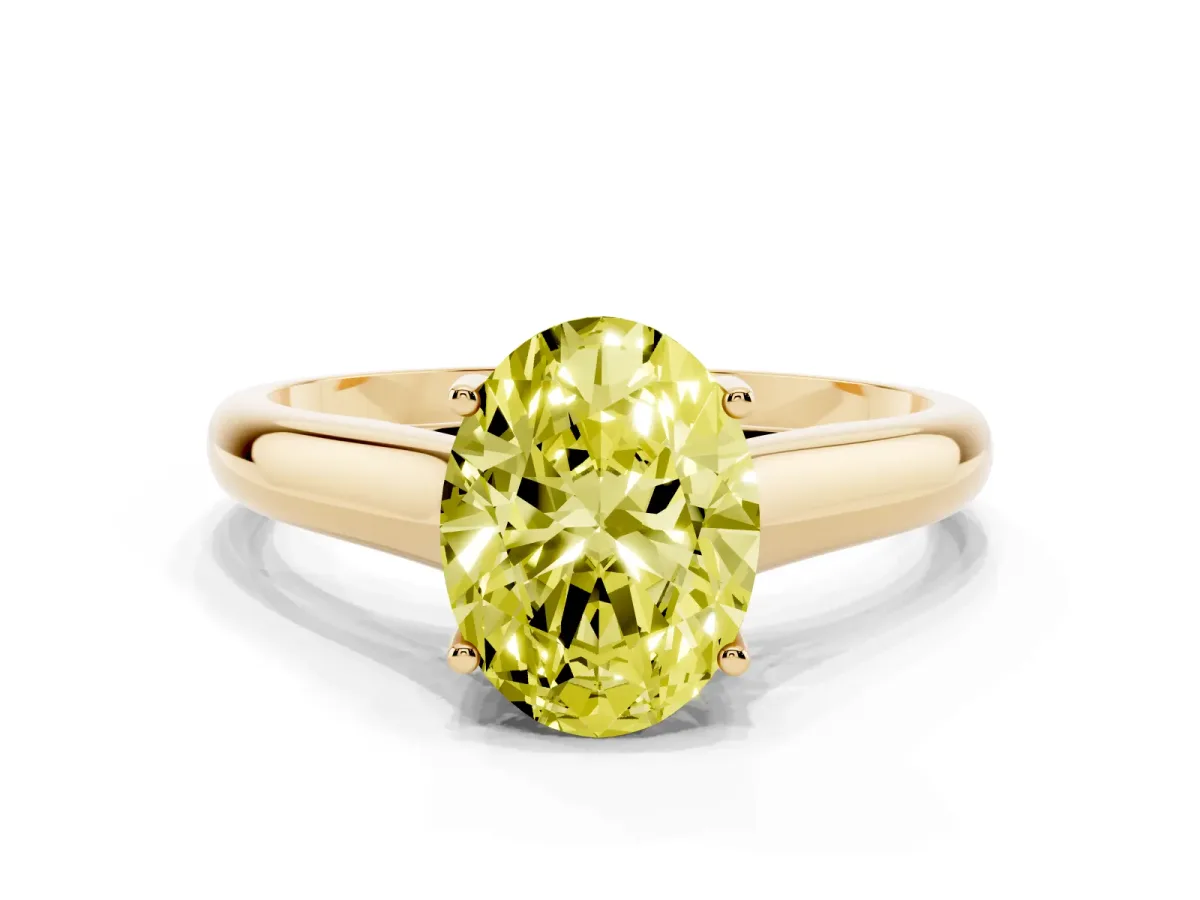 Fancy Yellow Oval Cut Solitaire Engagement Ring with Tapered Band and Four-Prong Setting Yellow gold