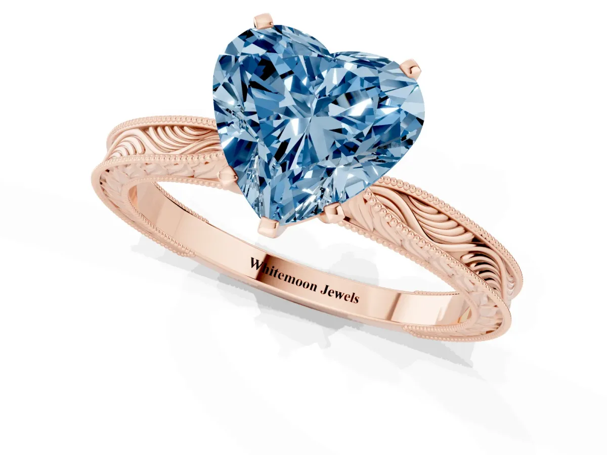 Fancy Blue Heart Cut Solitaire Milgrain Engraved Band with Four-Prong Setting Rose gold