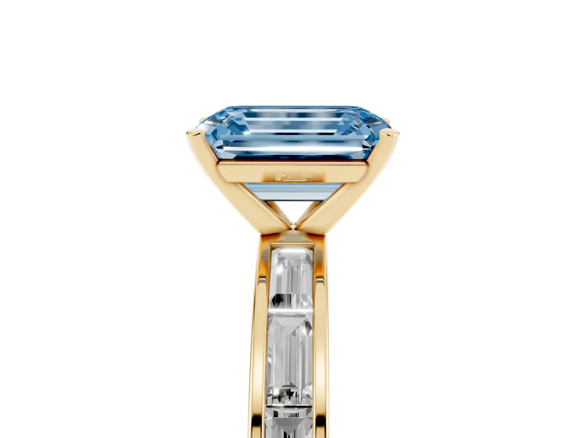 Fancy Blue Emerald Cut Solitaire Diamond Ring with Channel-Set Baguette Band and Four-Prong Setting Yellow gold