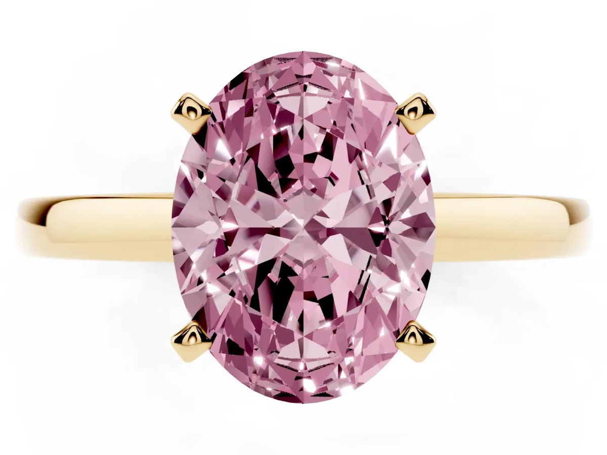 Fancy Pink Oval Cut Solitaire Diamond Engagement Ring with Four-Prong Setting on a Classic Band Yellow gold
