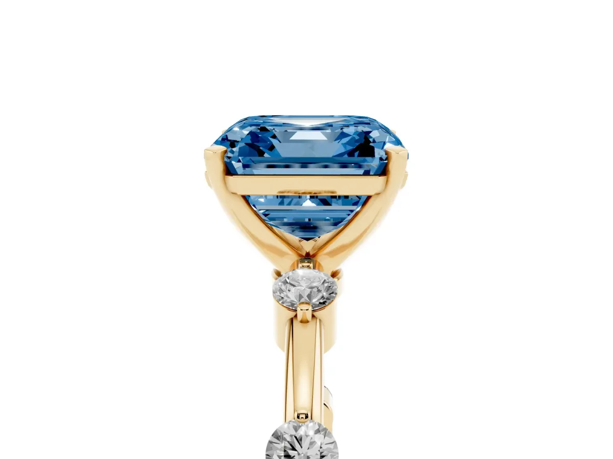 Fancy Blue Asscher Cut Solitaire Diamond Ring with Bezel Set Side Stones and Prong Setting Yellow gold