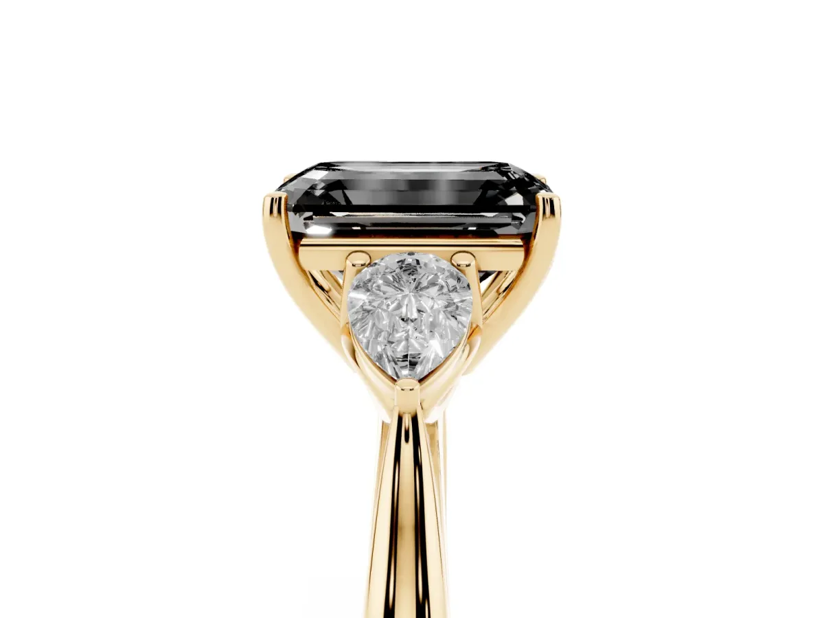 Fancy Black Emerald Cut Diamond Three-Stone Ring with Pear Side Stones and Prong Setting Yellow gold