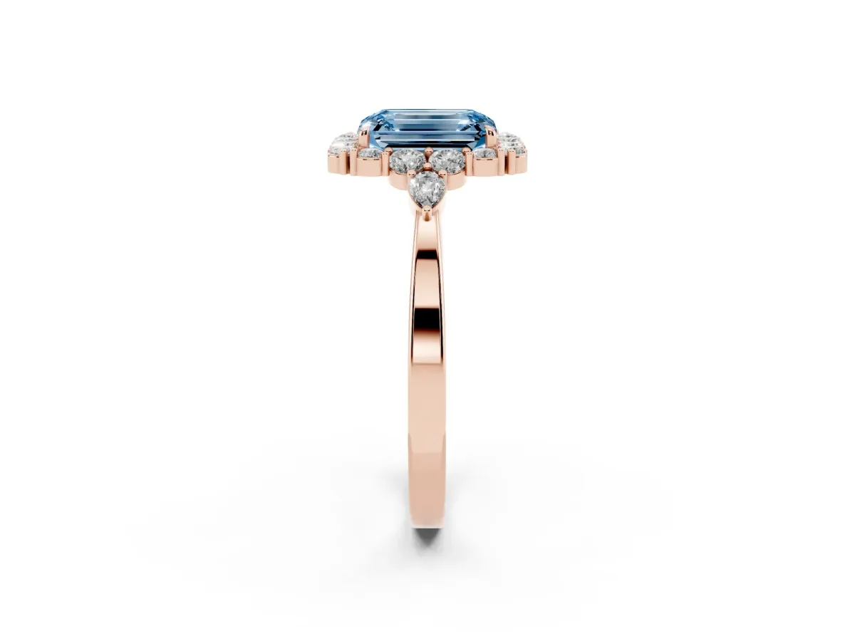 Fancy Blue Emerald Cut Diamond Halo Ring with Pear Side Stones and Prong Setting Rose gold