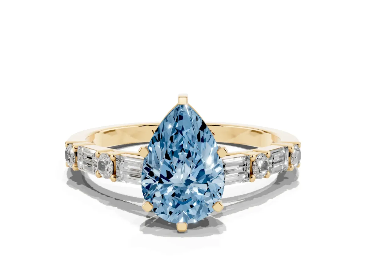 Fancy Blue Pear Cut Diamond Solitaire with Side Baguettes and Channel Set Band Yellow gold