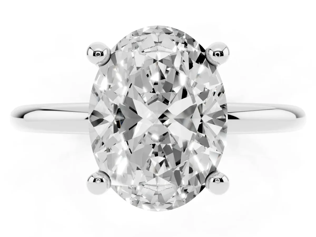 Oval Cut Solitaire Diamond Ring with 4-Prong Setting on a Classic Band Silver