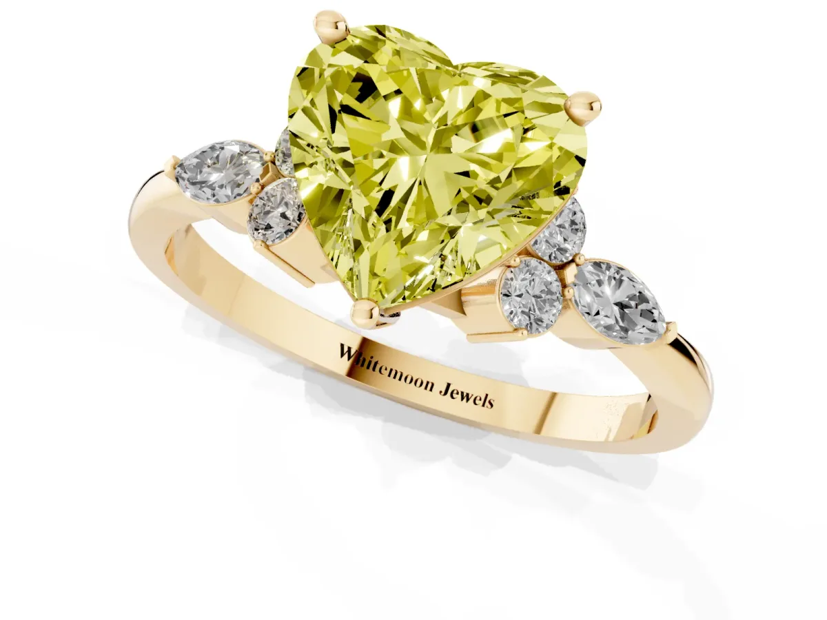 Fancy Yellow Heart Cut Brilliant Diamond Solitaire Ring with Pear Side Stones and Four-Prong Setting Yellow gold
