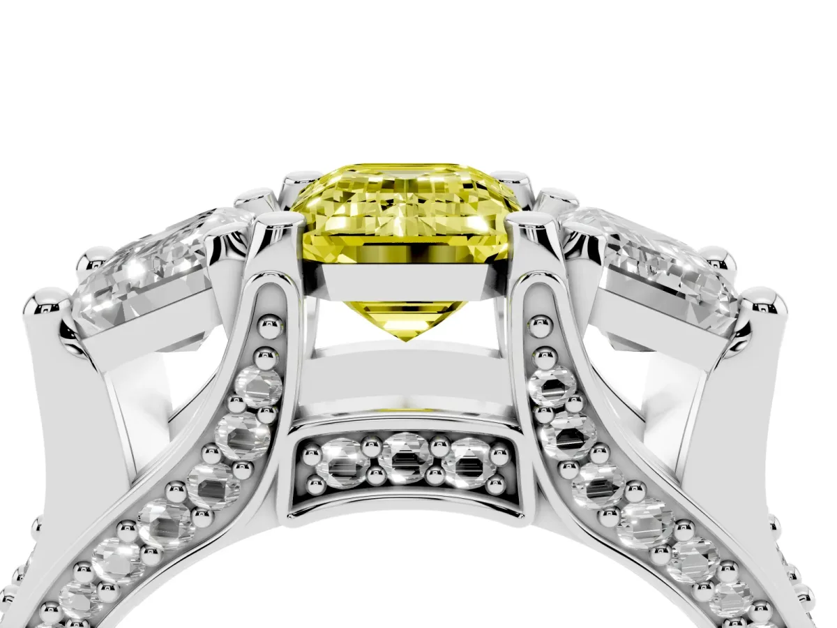 Fancy Yellow Emerald Cut Diamond Three-Stone Ring with Channel Set Band and Four-Prong Setting Platinum