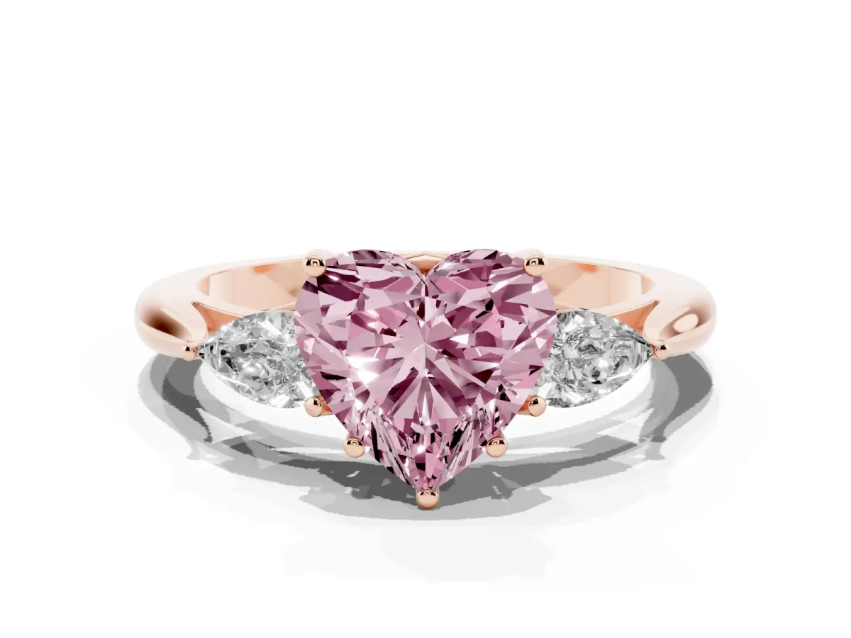 Fancy Pink Three-Stone Heart Cut Diamond Ring with Pear Side Stones in Four-Prong Setting Rose gold