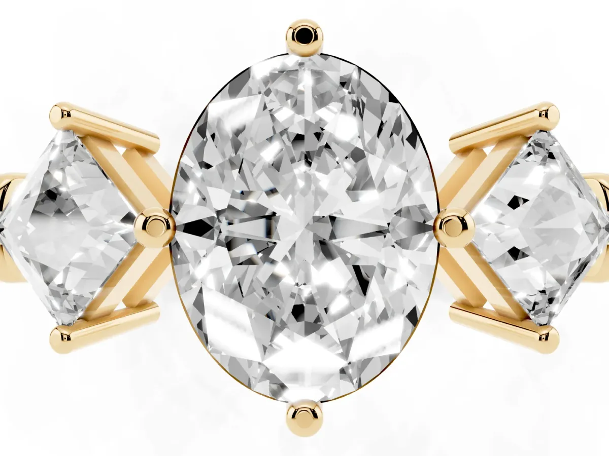 Three-Stone Oval Cut and Princess Cut Diamond Ring with Channel Band and Four-Prong Setting Yellow gold