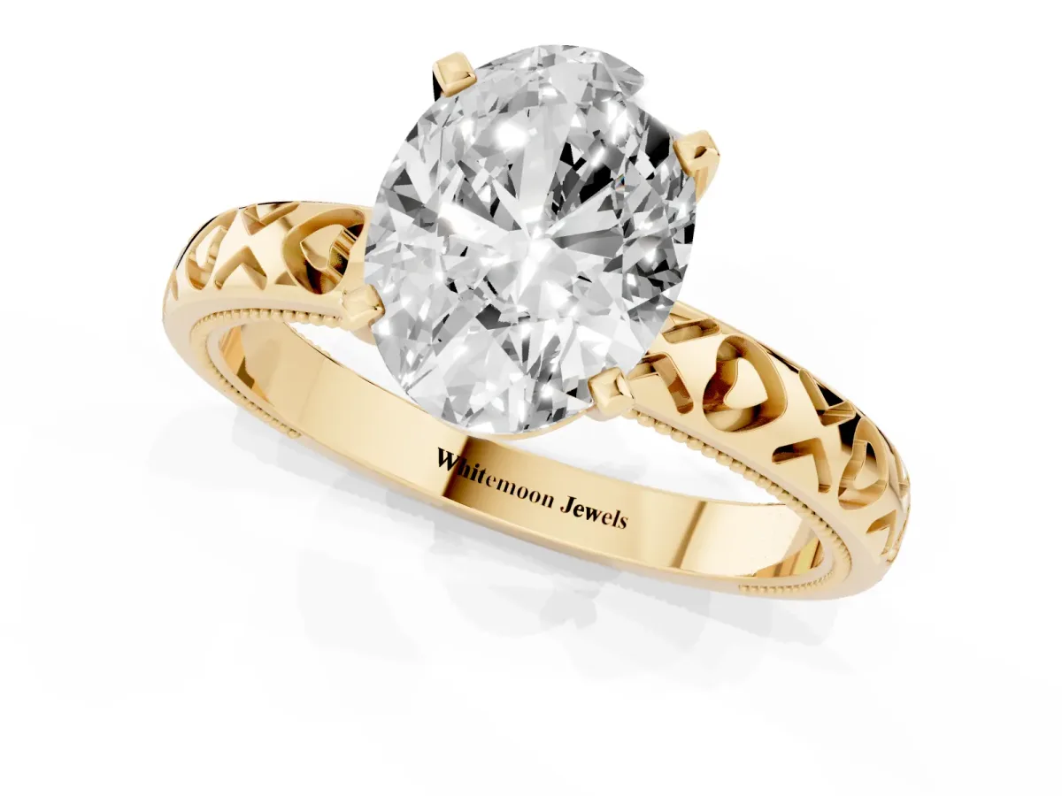 Oval Cut Solitaire Diamond Engagement Ring with XO Engraved Band and Four-Prong Setting Yellow gold