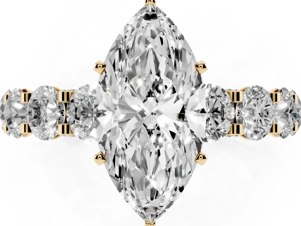 Marquise Cut Diamond Side Stone Engagement Ring with Four-Prong Setting Yellow gold