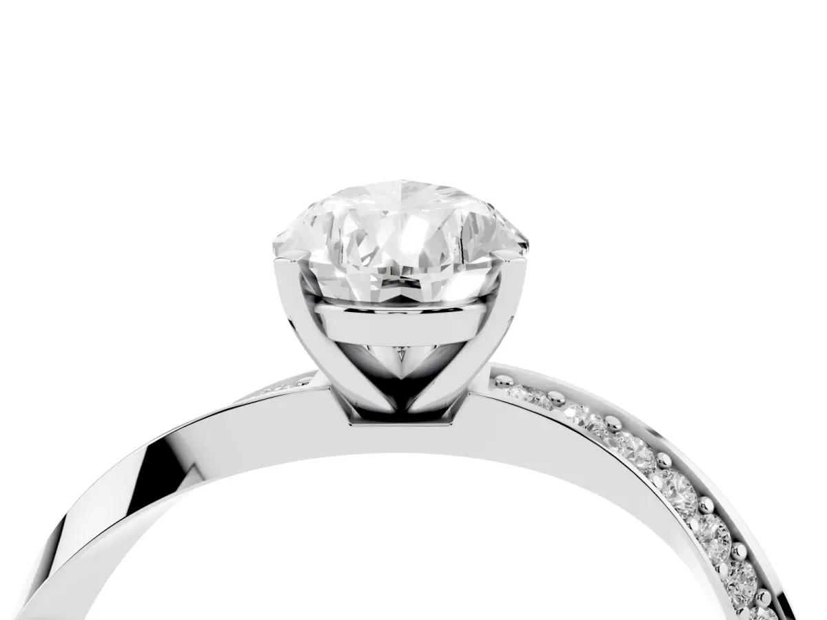 Pear Cut Diamond Engagement Ring with Side Stone Accents and Four-Prong Setting Silver
