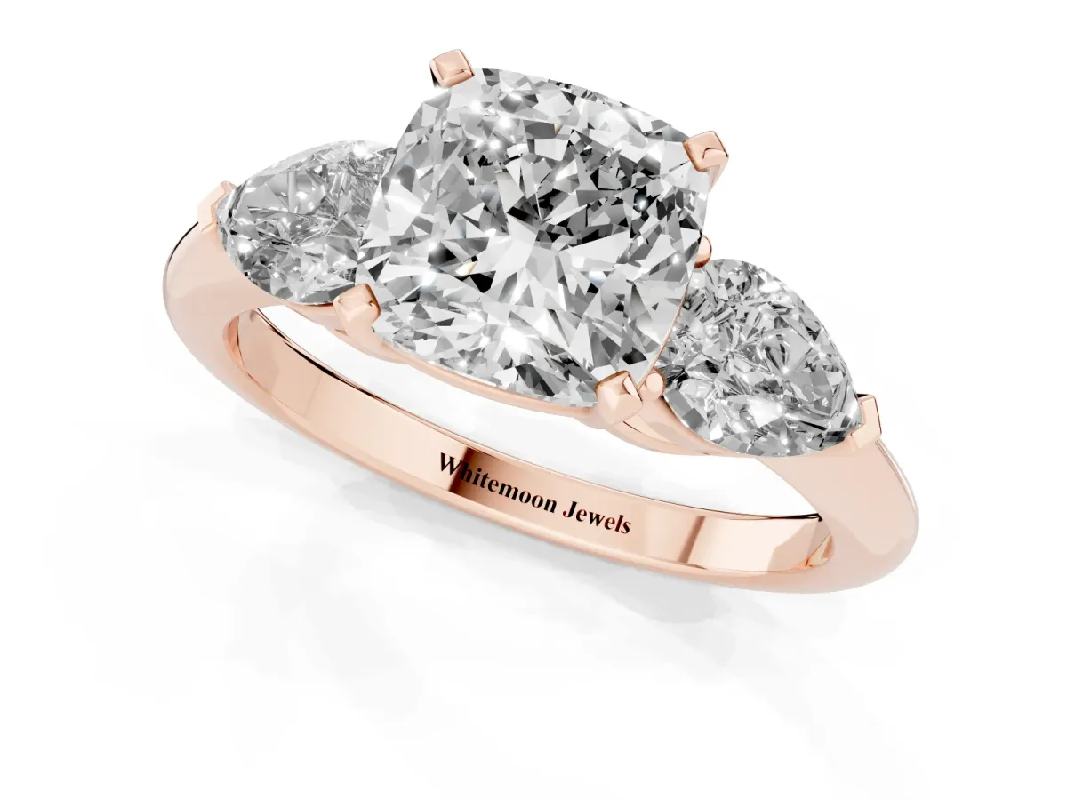 Three-Stone Cushion Cut Diamond Ring with Pear Side Stones and Four-Prong Setting Rose gold