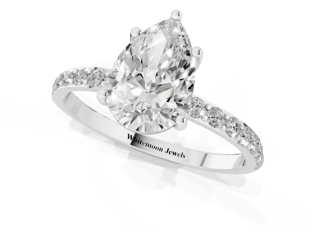 Pear Cut Diamond Solitaire Ring with Round Pavé Shoulders and Prong Setting Platinum
