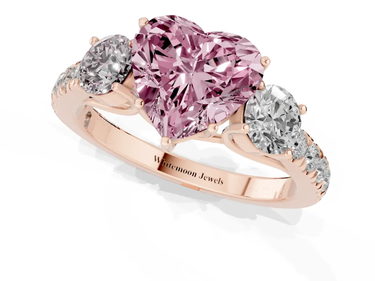 Fancy Pink Heart Cut Cut Diamond Three-Stone Ring with Round Side Stones and Pavé Band Rose gold