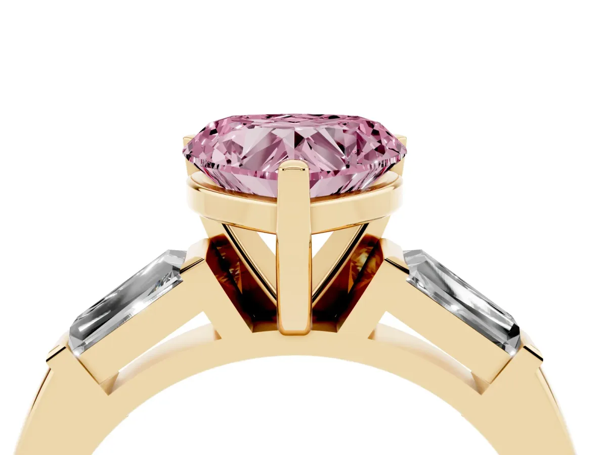 Fancy Pink Heart Cut Solitaire with Tapered Baguette Side Stones on a Classic Band with Four-Prong Setting Yellow gold
