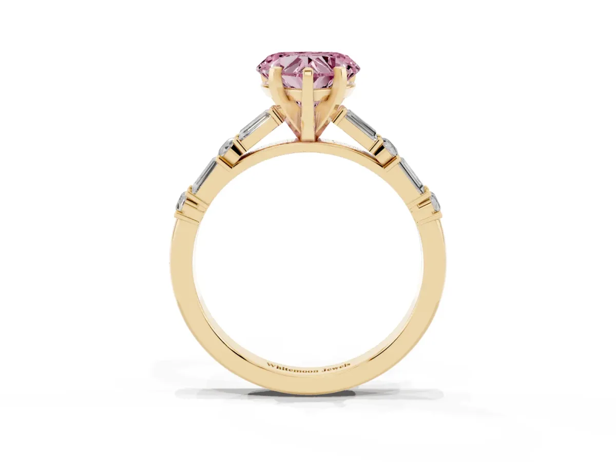 Fancy Pink Heart Cut Diamond Solitaire with Side Baguettes and Channel Set Band Yellow gold