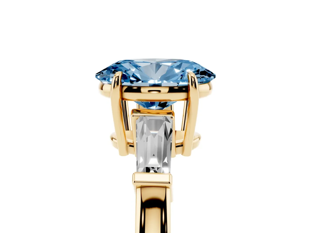 Fancy Blue Oval Cut Diamond Three-Stone Ring with Tapered Baguette Side Stones and Prong Setting Yellow gold