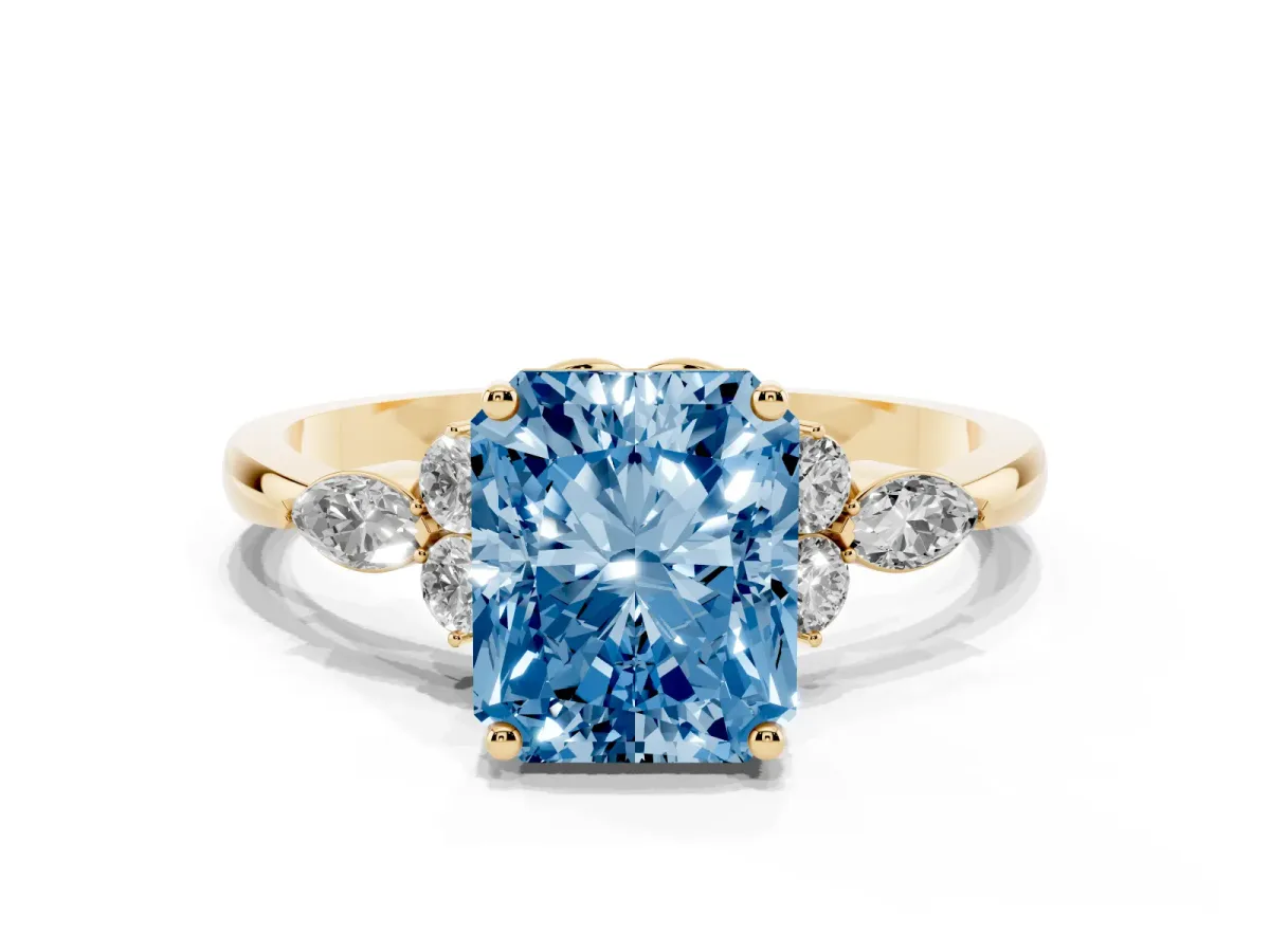 Fancy Blue Radiant Cut Brilliant Diamond Solitaire Ring with Pear Side Stones and Four-Prong Setting Yellow gold