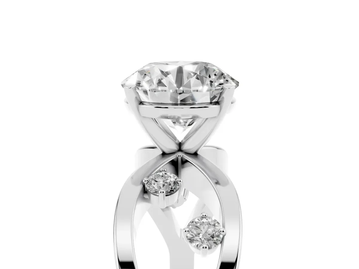 Round Cut Cut Solitaire Diamond with Side Stones on Criss-Cross Band and Four-Prong Setting Silver