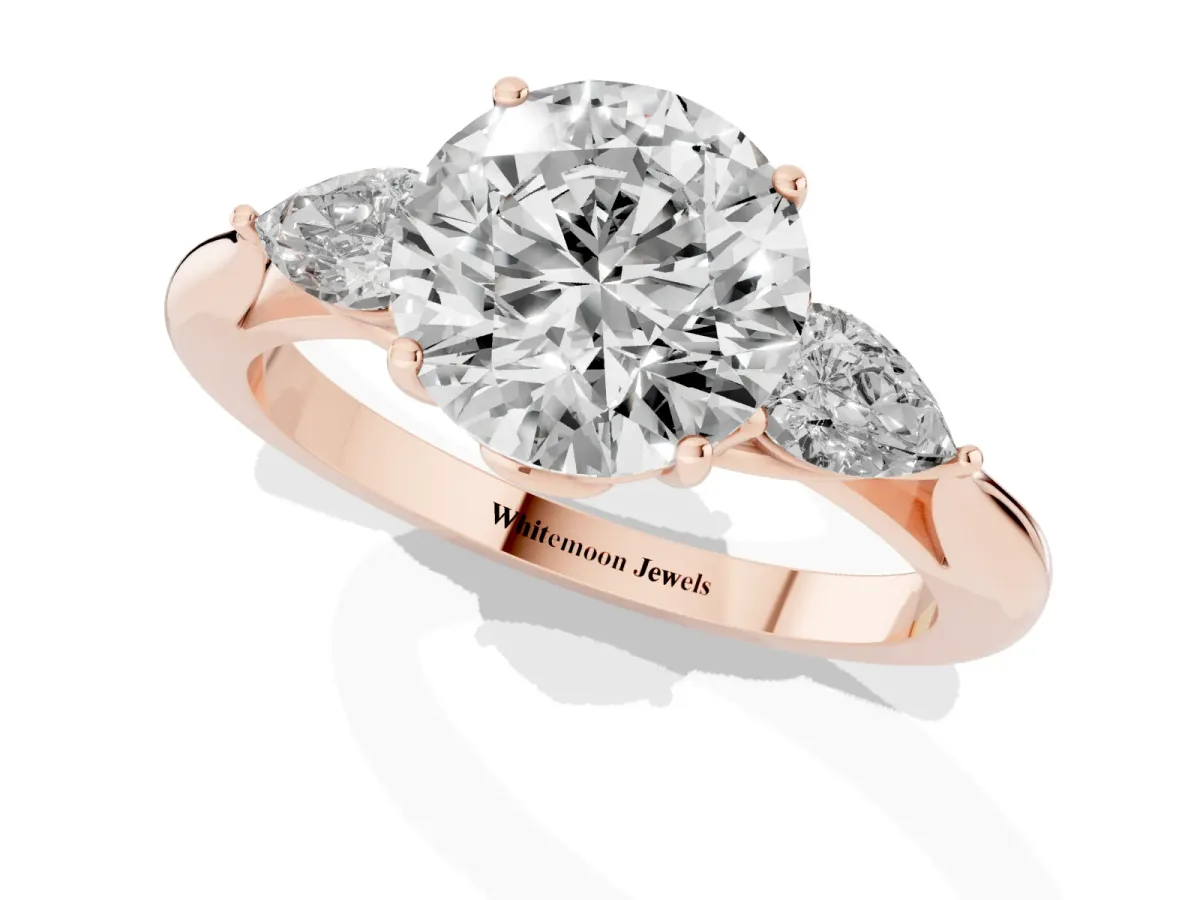 Three-Stone Round Cut Diamond Ring with Pear Side Stones in Four-Prong Setting Rose gold