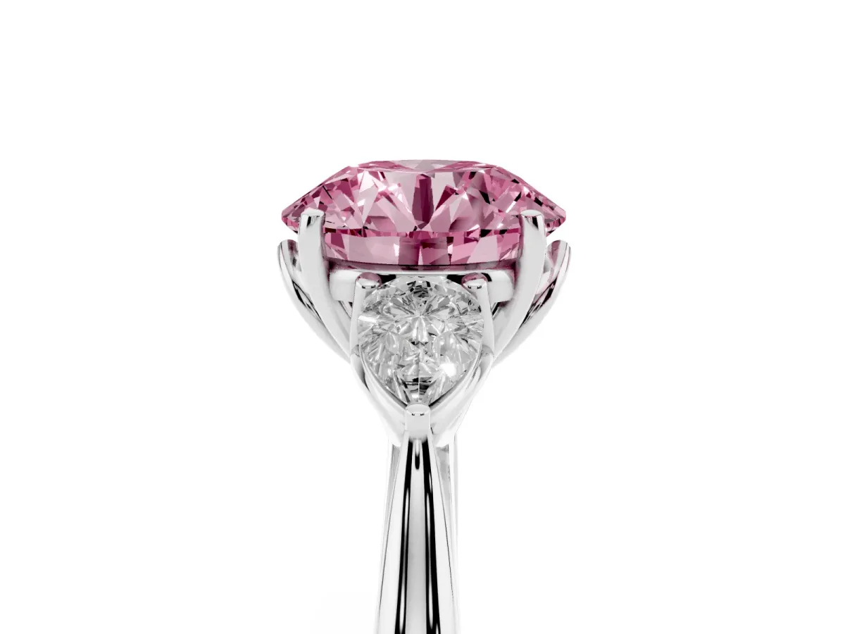 Fancy Pink Three-Stone Round Cut Diamond Ring with Pear Side Stones in Four-Prong Setting Platinum