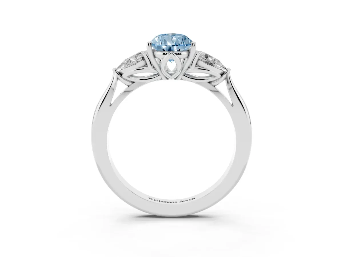 Fancy Blue Three-Stone Pear Cut Brilliant Diamond Solitaire Ring with Tapered Band and Four-Prong Setting White gold