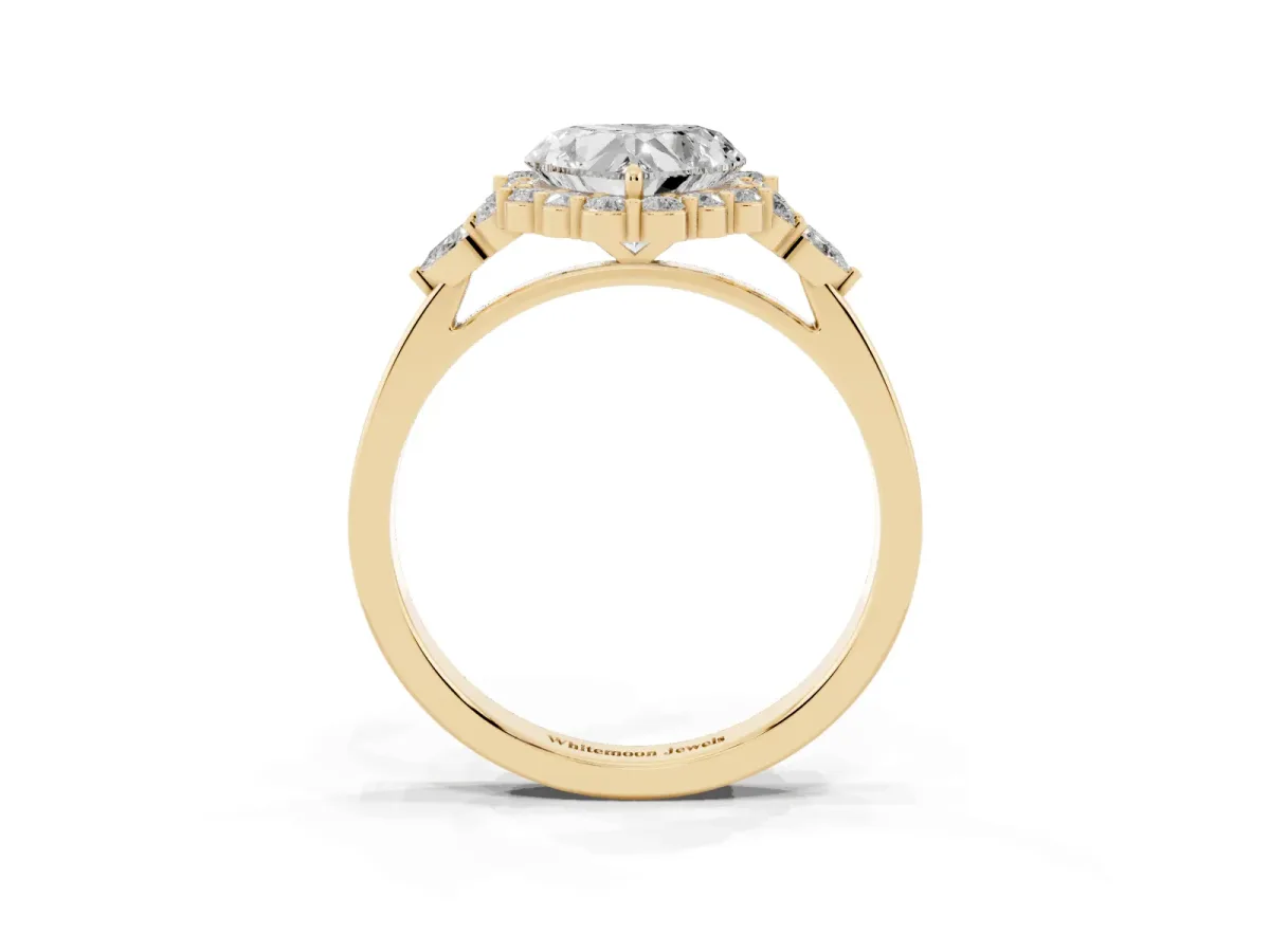 Heart Cut Diamond Halo Ring with Pear Side Stones and Prong Setting Yellow gold