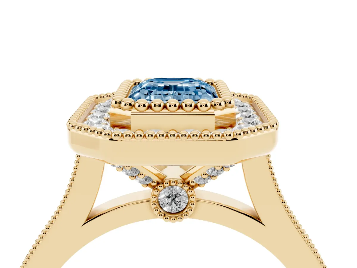 Fancy Blue Emerald Cut Diamond Halo Ring with Milgrain Frame and Pavé Band Yellow gold