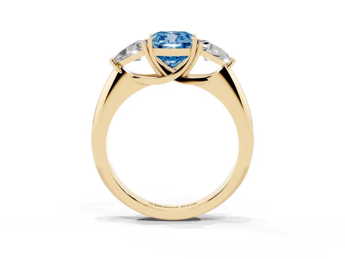 Fancy Blue Three-Stone Cushion Cut Diamond Engagement Ring with Trillion Side Stones and Prong Setting Yellow gold