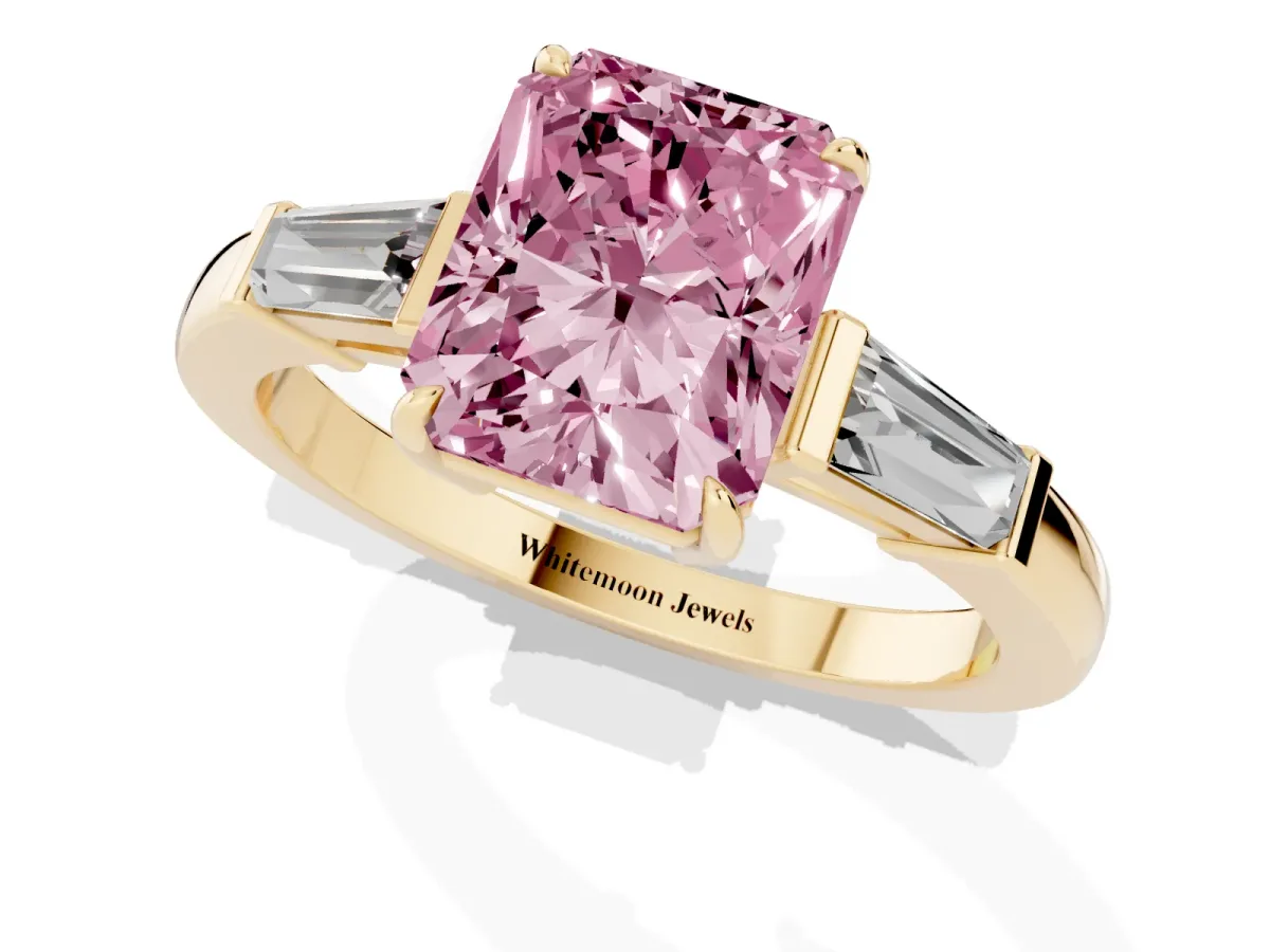 Fancy Pink Radiant Cut Diamond Three-Stone Ring with Tapered Baguette Side Stones and Prong Setting Yellow gold