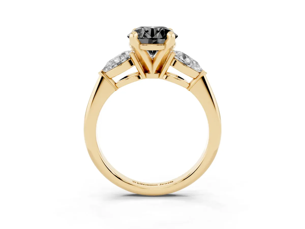 Fancy Black Three-Stone Round Cut Diamond Ring with Pear Side Stones and Four-Prong Setting Yellow gold
