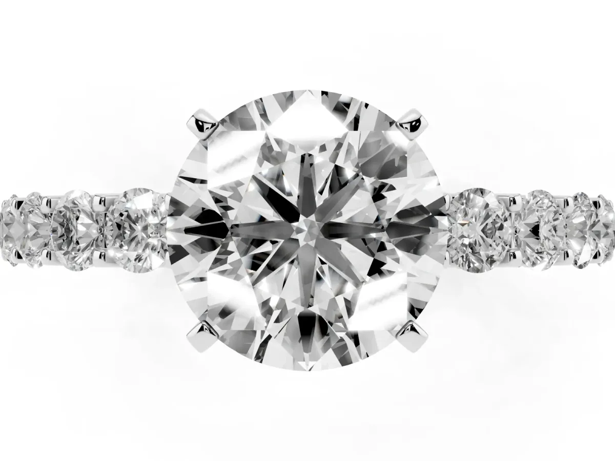 Round Cut Diamond Solitaire Ring with Shared Prong Pavé Band and Four-Prong Setting Silver