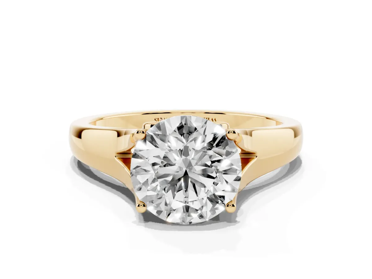 Round Cut Solitaire Diamond Ring with Cathedral Band and Four-Prong Setting Yellow gold